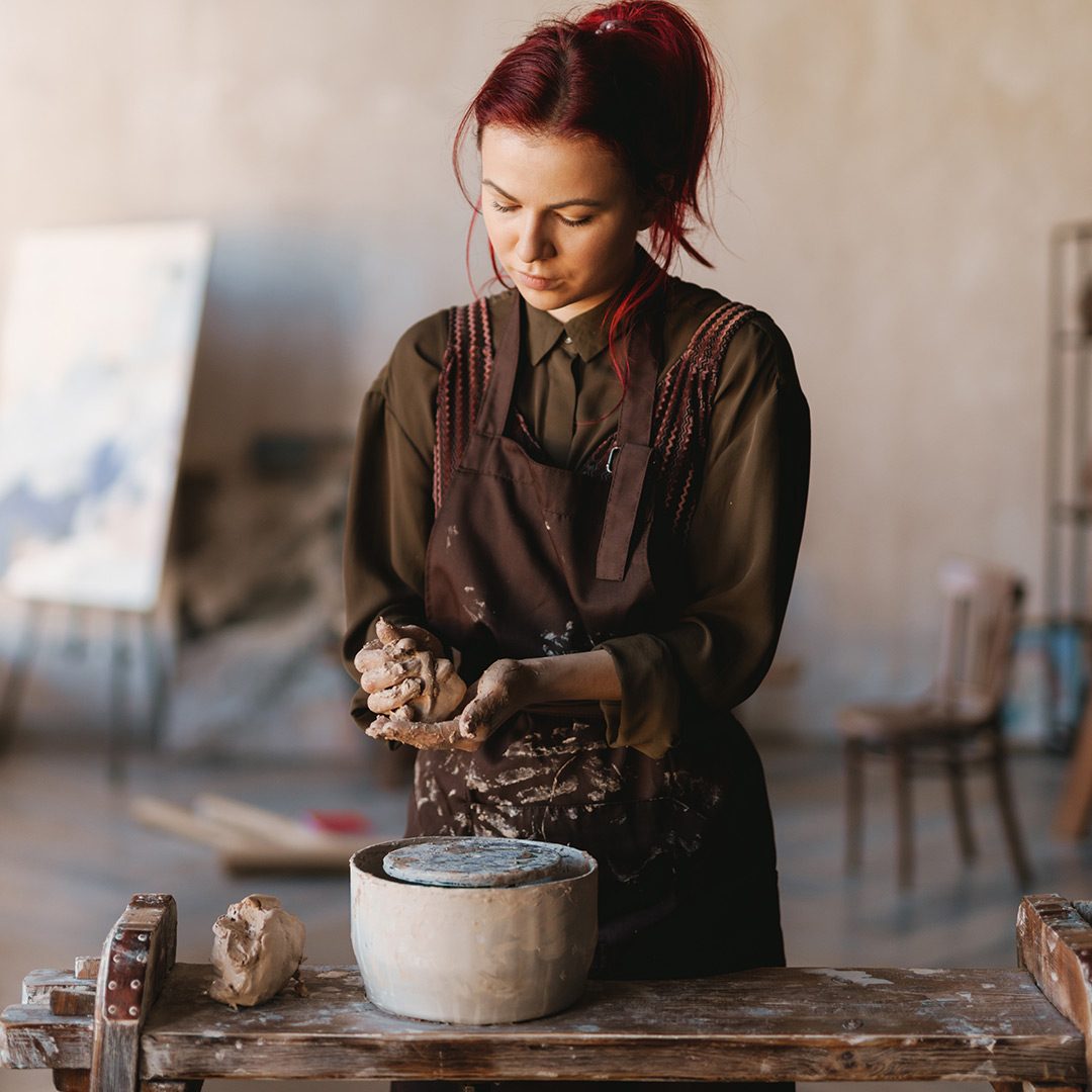 young-woman-sculptor-artist-creating-a-bust-sculpt